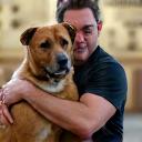 Carlos G. with his rescue dog, Luna.